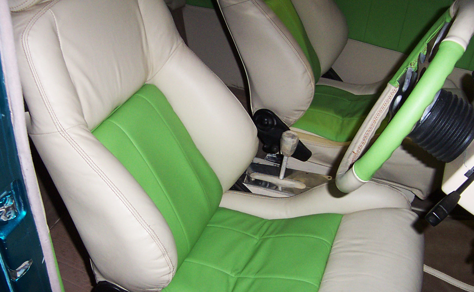Cream+and+green+interior%2C+panelling%2C+seats+and+steering+wheel